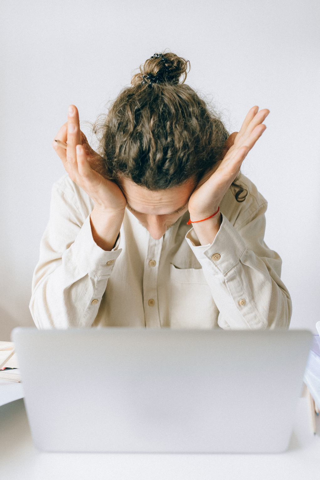 An Exhausted Man Working on His Laptop